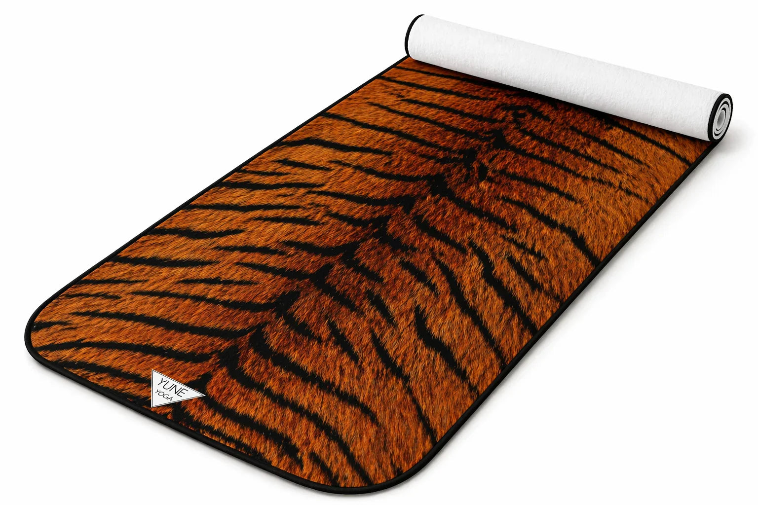 Tiger print yoga mat with rolled white edge on white background