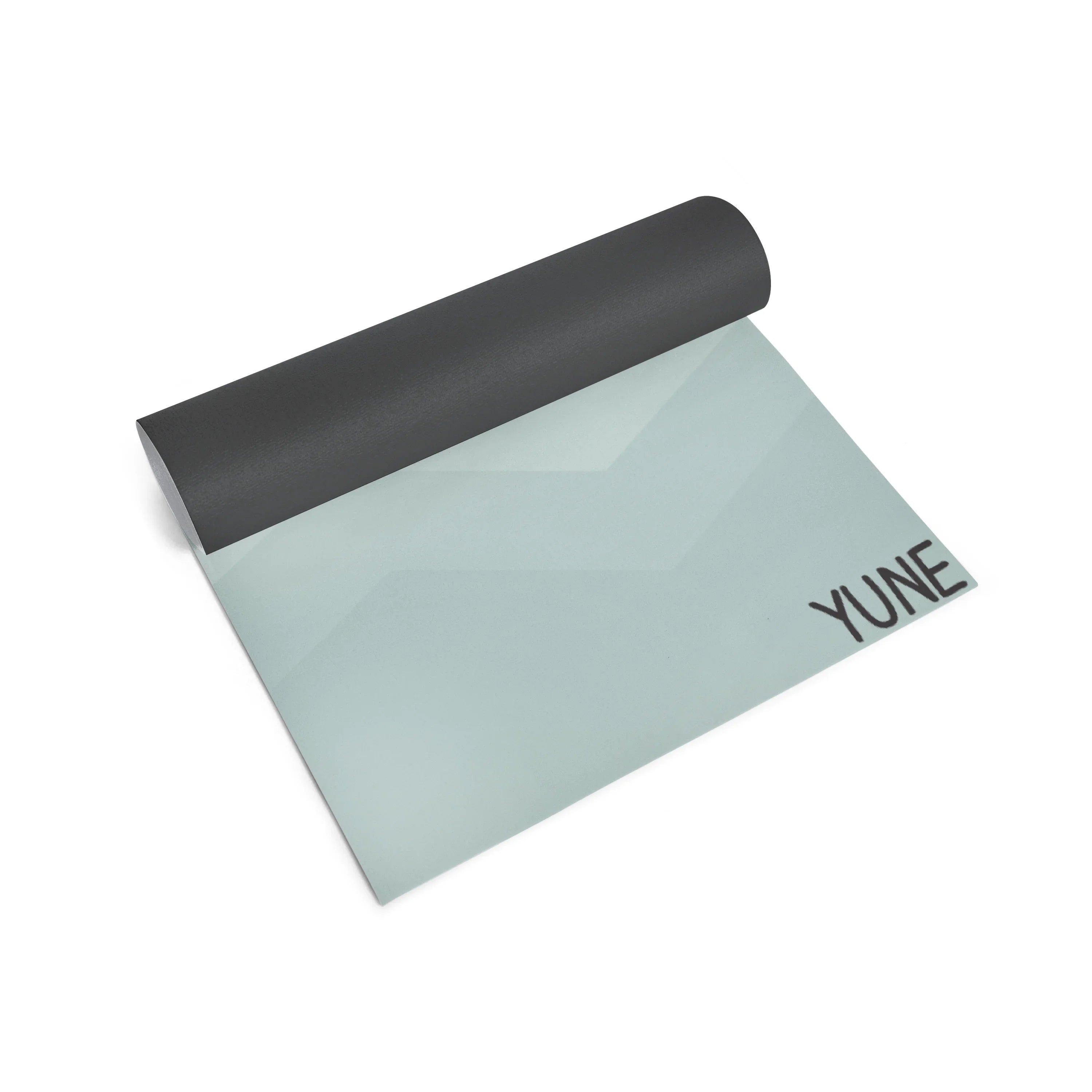Yoga mat with black top and light gray bottom on a white background