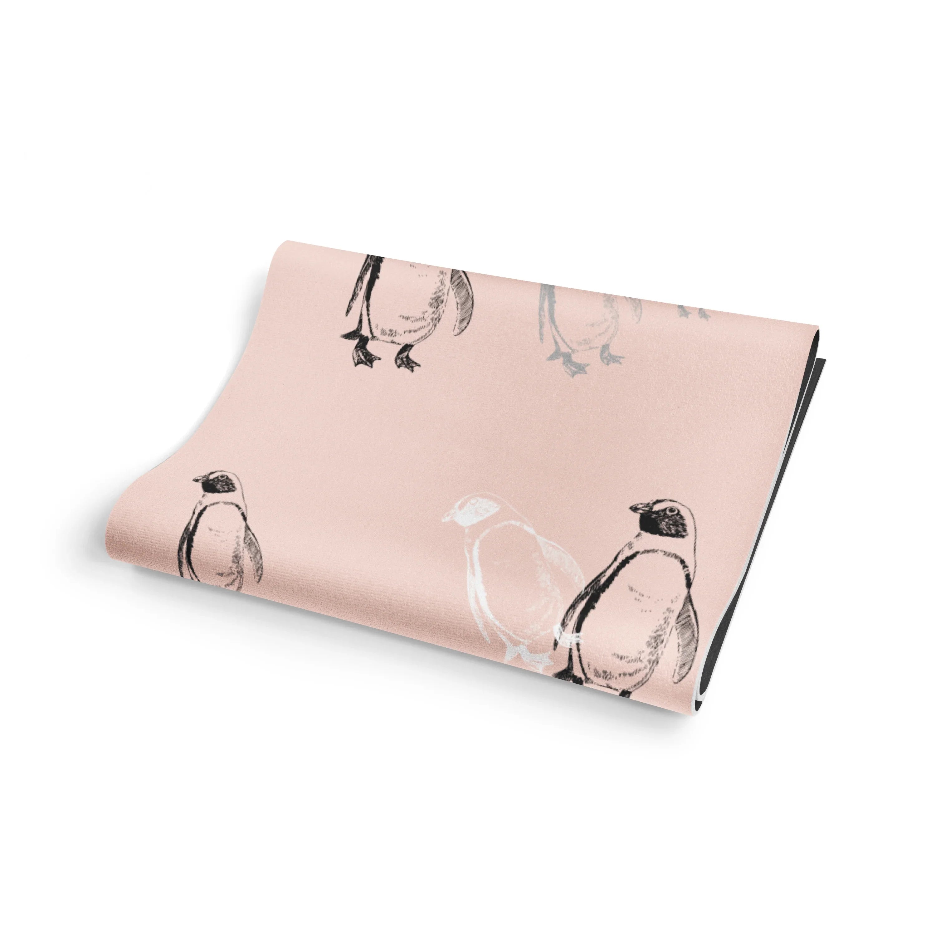 Folded pink fabric with penguin pattern on a white background