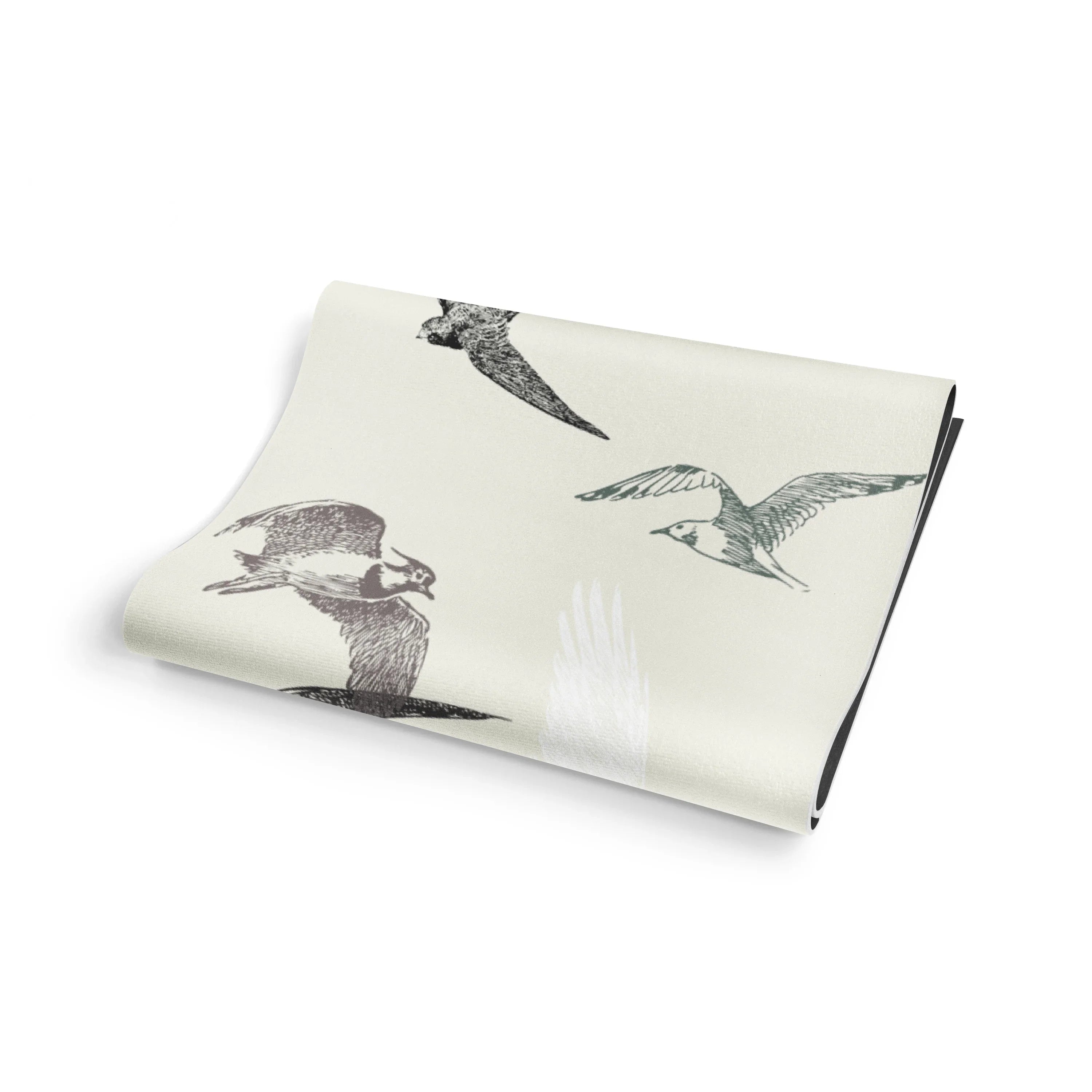 Folded fabric with bird illustrations on a white background