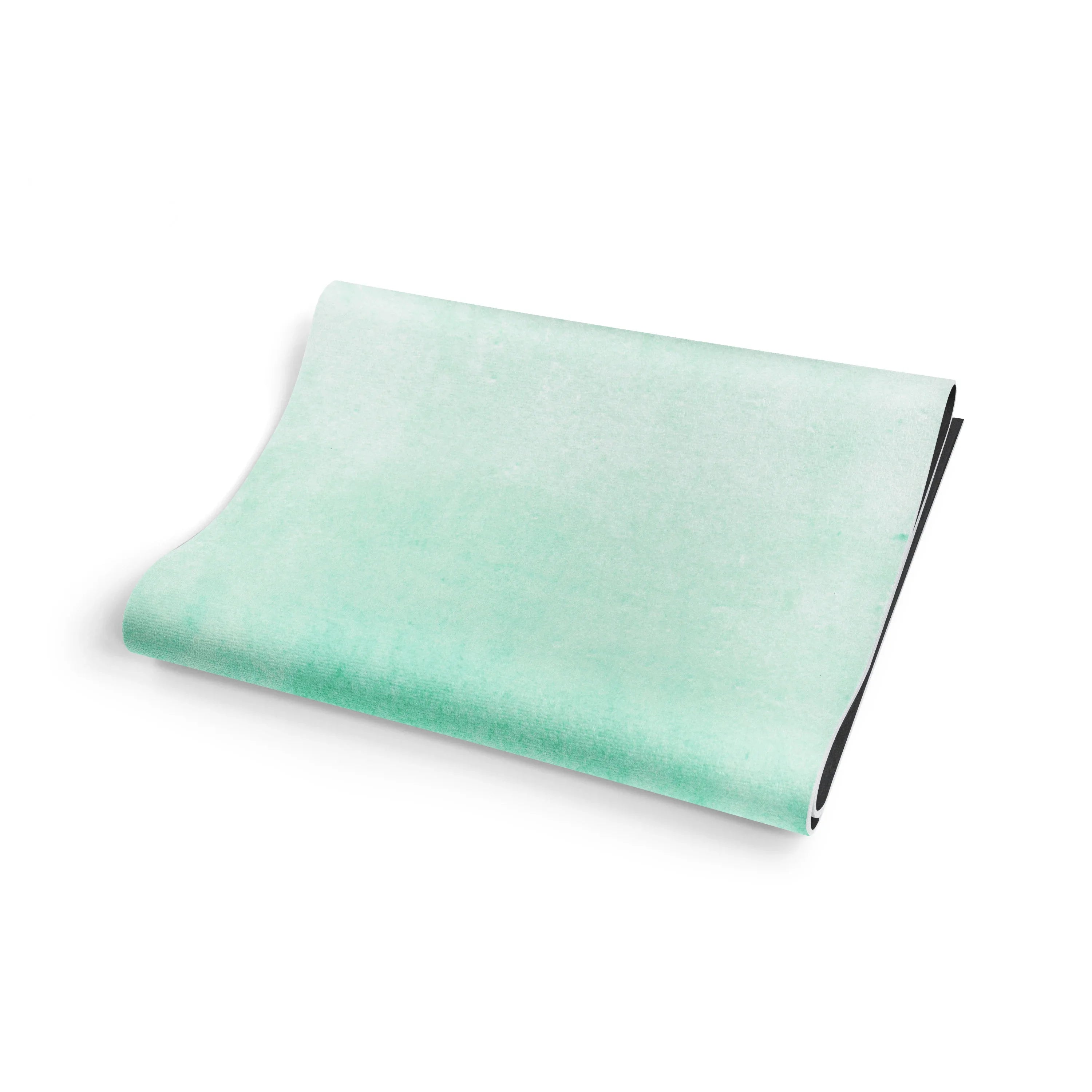 Folded light green fabric on a white background