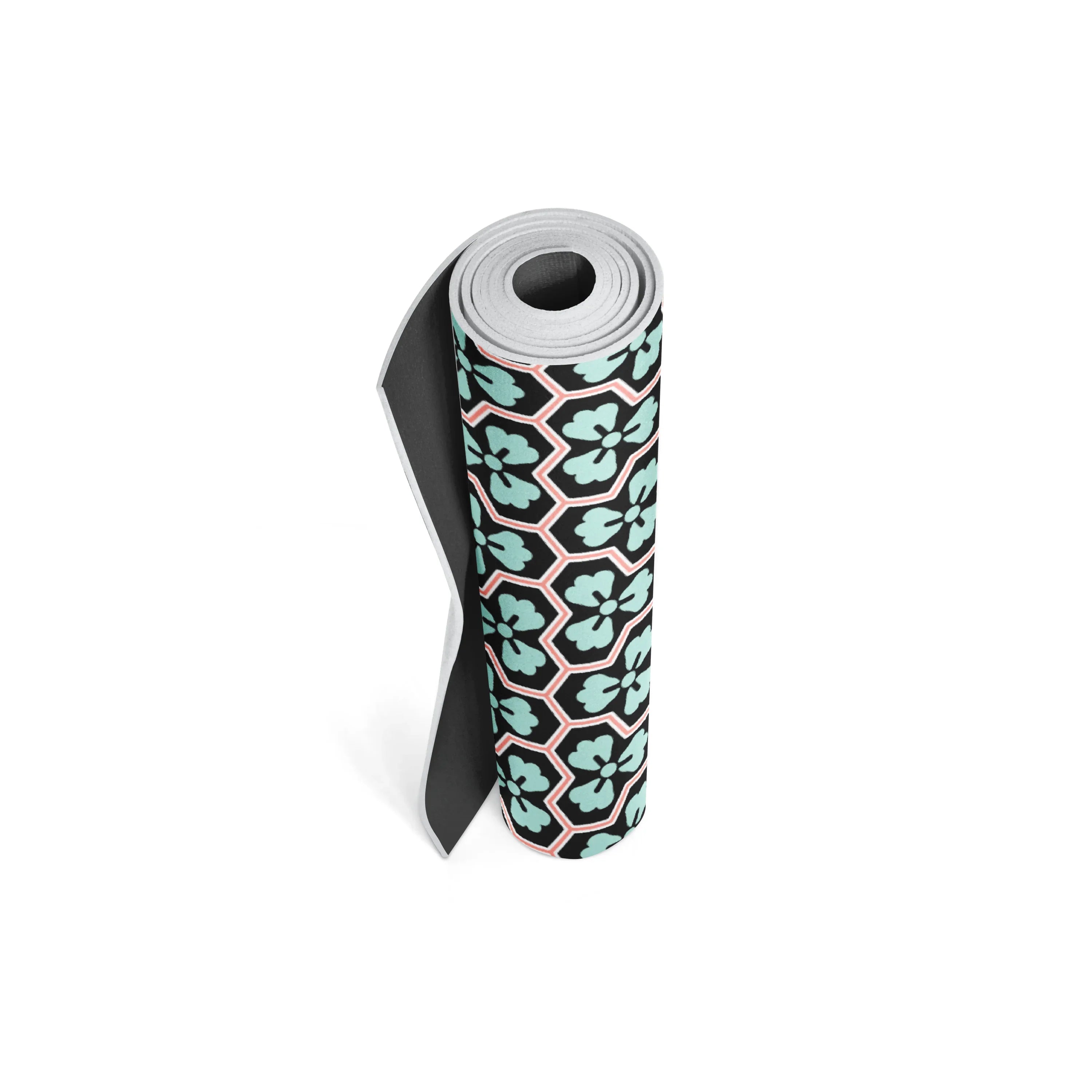 Yoga mat with a black and pink geometric pattern on a white background