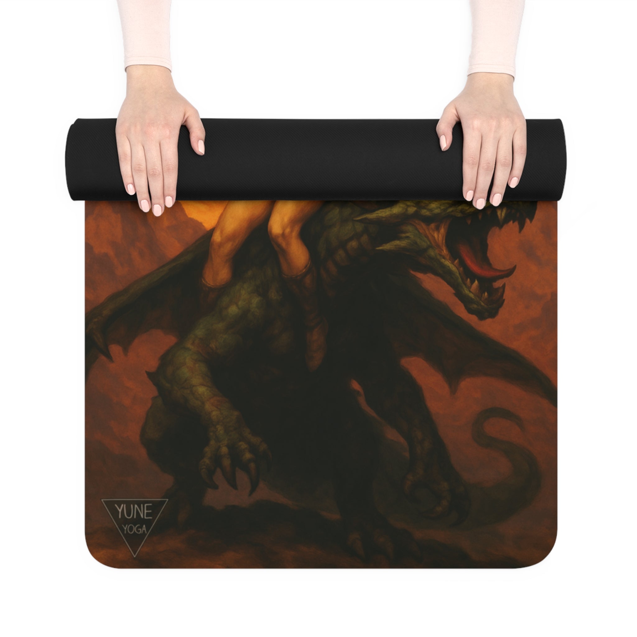 Yoga mat with dragon design held by a person on a white background