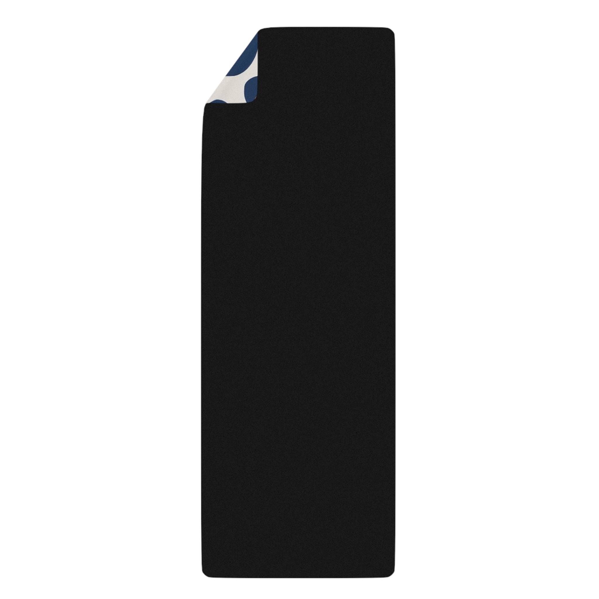 Black towel with a corner folded over on a white background