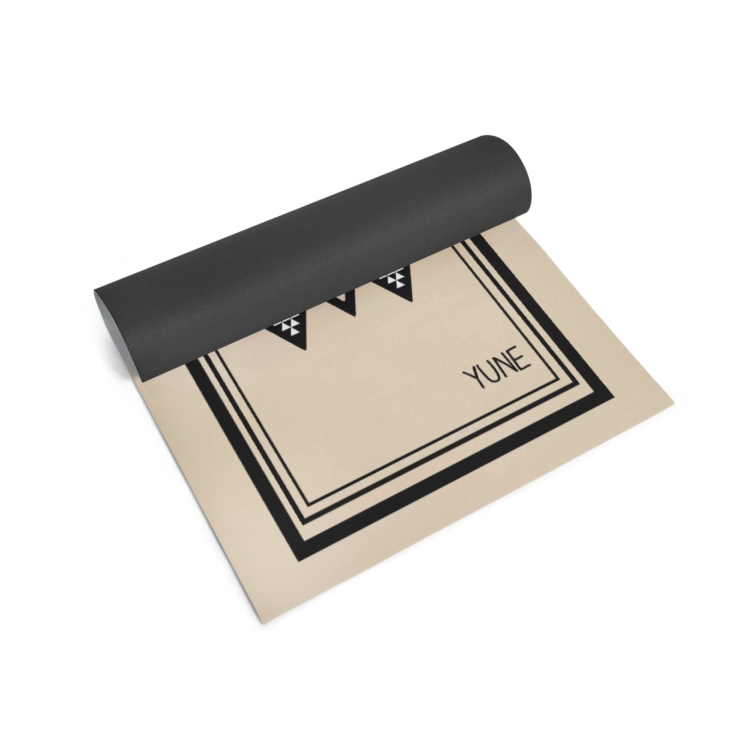 Yoga mat with black top and beige bottom on a white background