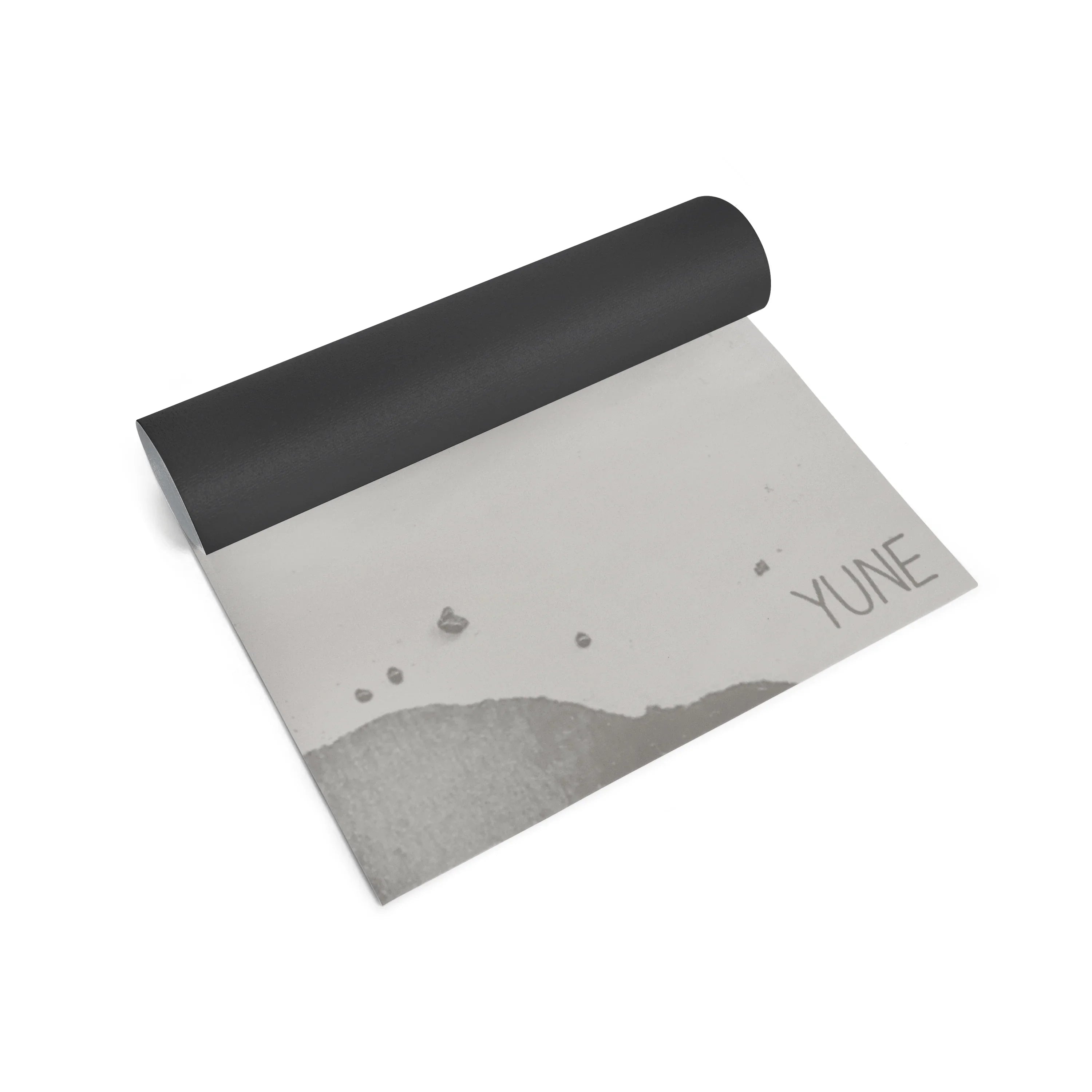 Yoga mat with black top and gray bottom featuring a landscape design and 'YUNE' branding on a white background.