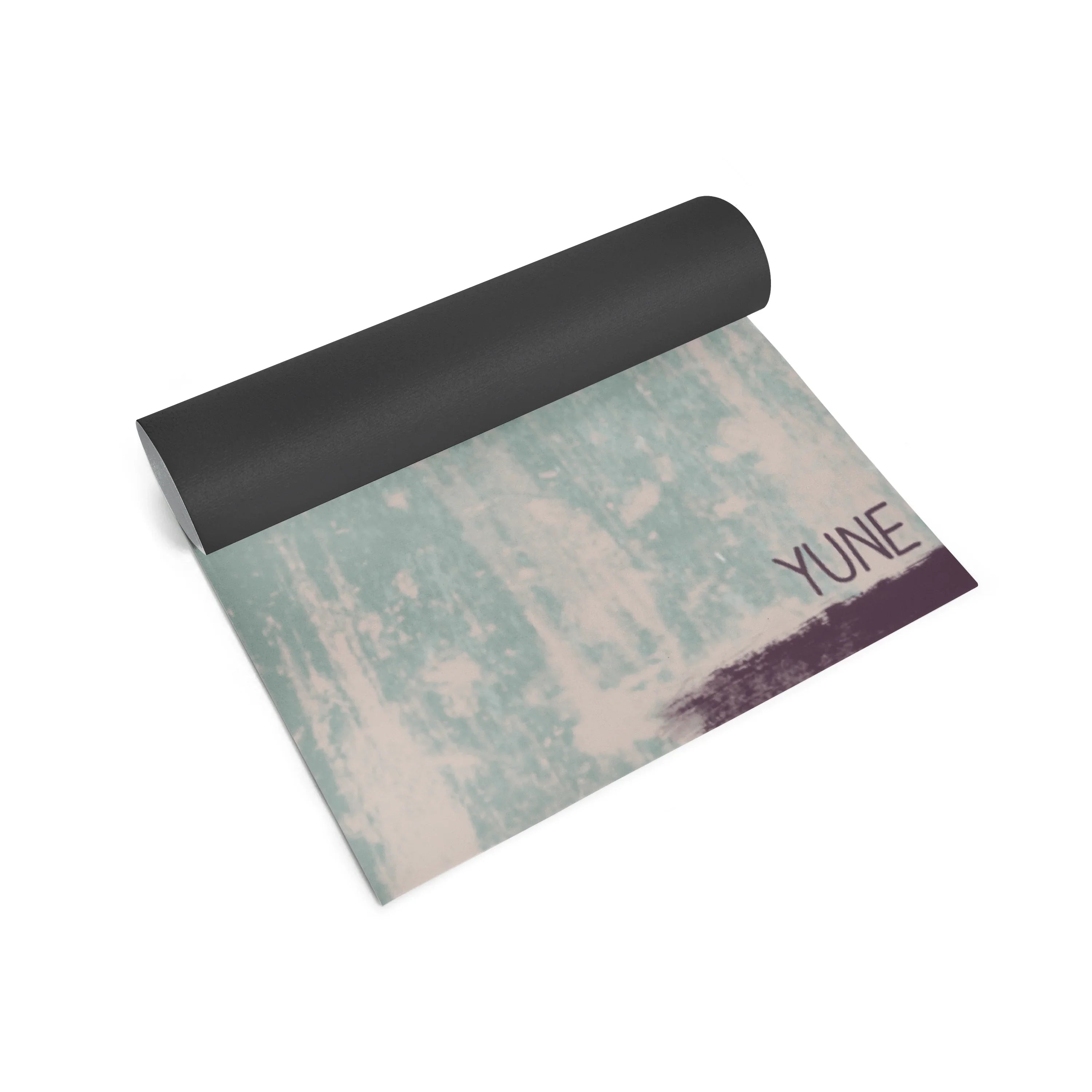 Yoga mat with a patterned design and 'YUNE' branding on a white background